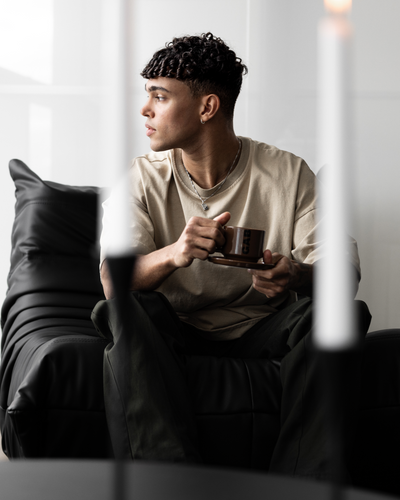 MAN RELAXING SIPPING COFFEE